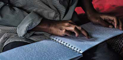 Santri membaca Al-Qur’an Braille.