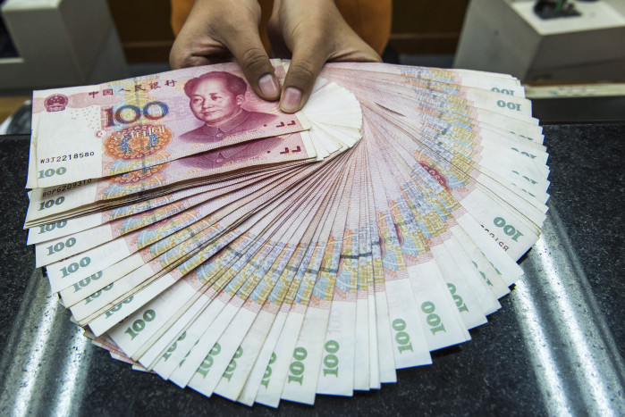 Yuan Terkoreksi 448 basis poin menjadi 6,9791 terhadap Dolar AS